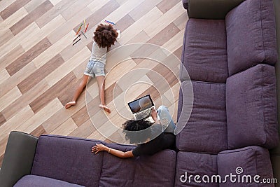 Above view african mother little daughter spending time at home Stock Photo