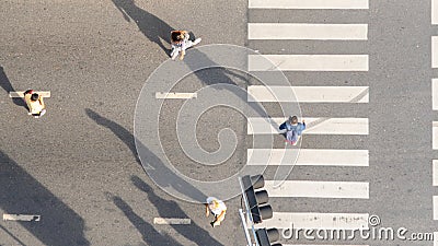 Top aerial view people walk on across pedestrian at the outdoor pedestrian concrete ground Editorial Stock Photo