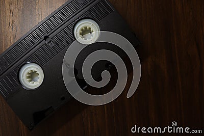 Top angle shot of old Video Cassette on wooden Background. World Day for Audiovisual Heritage Stock Photo