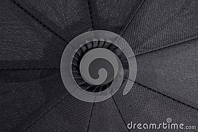 Top of a black waterproof umbrella Stock Photo