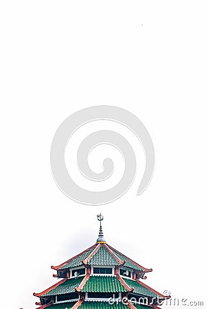 Top building of local mosque with Arabic and Chinese aculturation. It built with pagoda shape and crecent and star statue Stock Photo