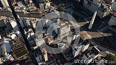 Top close view on iconic Obelisk and grand avenue in Buenos Aires with no traffic, sunset time Editorial Stock Photo