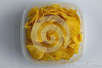 Top closeup view of delicious crispy snacks such as salted potato chips Stock Photo