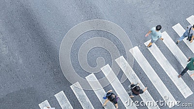 the From the top crosswise view of people walk on street pedestrian crossroad in the city street ,bird eye view. Stock Photo