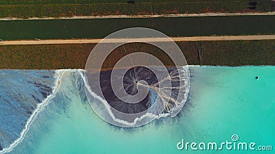 Top down aerial view over natural texture - abstract industrial lake water patterns. Turquoise waternature poluttion Stock Photo