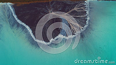 Top down aerial view over natural texture - abstract industrial lake water patterns. Turquoise waternature poluttion Stock Photo