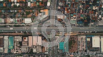 Top down cars drive at cross freeway in aerial view. Highway traffic transportation at Manila city Stock Photo