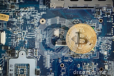 Top Down Gold Digital Cryptocurrency Coin on Computer Motherboard. Bitcoin Mining Concept. Crypto Currency Background. Editorial Stock Photo