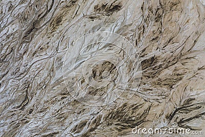 Top down view on abstract patterns and shapes of mineral waste rivers from power plant Stock Photo