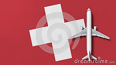 Top-down view of the airplane on the flag of Switzerland. Tourism related conceptual 3D rendering Stock Photo