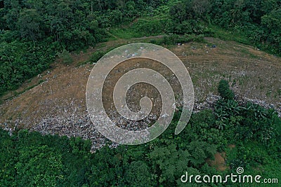 Top down view of a garbage landfill, showing the loads of garbage being dumped Stock Photo