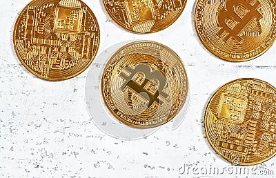 Top down view, golden commemorative btc - bitcoin cryptocurrency - coins scattered on white stone board, closeup detail Stock Photo