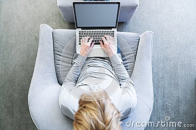 Top down view of person typing on laptop Stock Photo