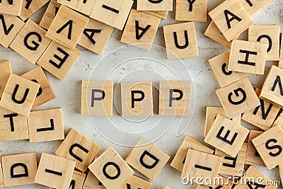 Top down view, pile of square wooden blocks with letters PPP stands for Praise, Picture, Push on white board Stock Photo