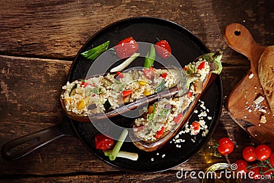 Top down view of a stuffed aubergine with couscous or quinoa Stock Photo
