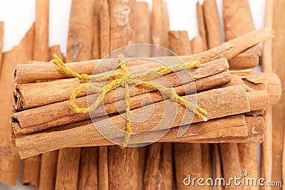 Top front view bundle of Raw Organic Cinnamon sticks (Cinnamomum verum). Stock Photo