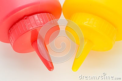 Top of a ketchup and mustard bottle closeup Stock Photo