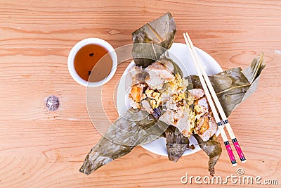 Top lay view of steamed Chinese rice dumpling or zongzi served with oriental tea Stock Photo