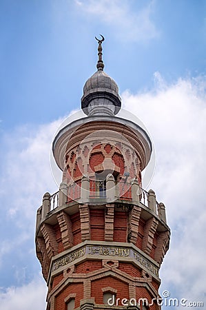 Top of the minaret of the Sunni Mukhtarov Mosque in Vladikavkaz city, North Ossetia Alania, Russia in front of bright Stock Photo