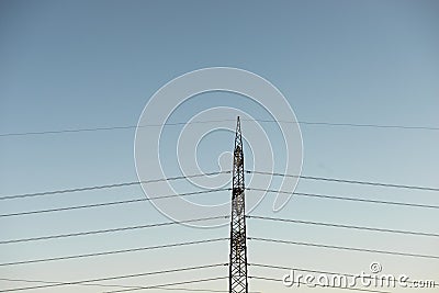 Top old electrical pillar on a background of the blue sky Stock Photo