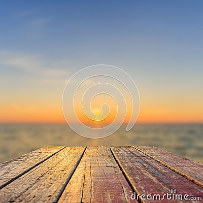 Top of old wooden table with blur sunset background Stock Photo