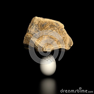 Heavy rock on cracked egg Stock Photo