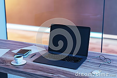 Top perspective view on blank black modern laptop screen with space for your web design or landing page on wooden table with Editorial Stock Photo