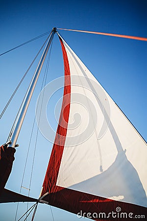 Top of the sailboat, mast head, sail and nautical rope yacht detail. Yachting, marine background Stock Photo