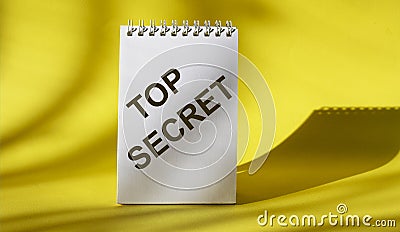 TOP SECRET text on white notepad Stock Photo