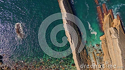 Top stone ocean coast washed by turquoise waves. Amazing rippling sea water Stock Photo