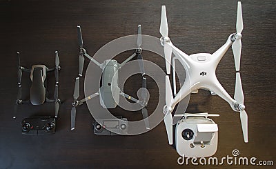 Top up comparison photo of the sizes of 3 drones - Mavic Air, Mavic Pro and Phantom 4 Editorial Stock Photo