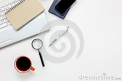 Top view accessories office desk concept.mobile phone,notepaper,pen,laptop,Magnifier on white office desk. Stock Photo