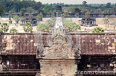 Top view on alley with tourists near historical landscape of Angkor What temple, 12th century Khmer landmark Stock Photo