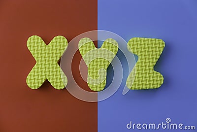 Top view of alphabet XYZ on two color background which are red and blue Stock Photo