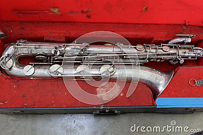 top view of antique silver saxophone instrument collection broken instrument can't use Stock Photo