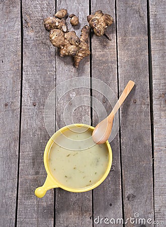 Top view of artichoke soup in yellow bowl Stock Photo