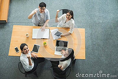 Top view of asian business people team analyzing statistics financial. High angle view of a team of businesspeople Meeting Stock Photo