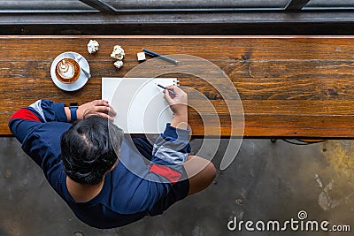 Top view of Asian designer drawing on sketchbook by pencil Stock Photo