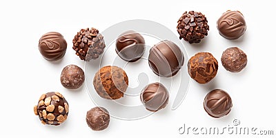 Top view of assorted chocolate truffles with various toppings arranged in neat rows on a white background Stock Photo