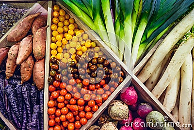 Top view Assortment of fresh vegetables at market counter, vegetable shop, farmer marketplace. Organic, healthy, vegetarian diet f Stock Photo