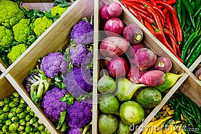Top view Assortment of fresh vegetables at market counter, vegetable shop, farmer marketplace. Organic, healthy, vegetarian diet f Stock Photo