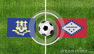 Top view ball with Connecticut vs. Arkansas flags match on green soccer field Stock Photo