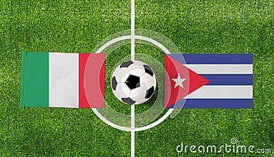 Top view ball with Italy vs. Cuba flags match on green football field Stock Photo