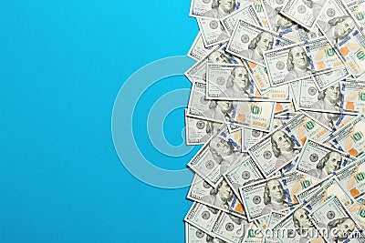 Top view banknotes on colored desk with copy space on top. one hundred dollar bills with stack of money in the middle. Top view of Stock Photo