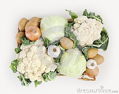 Top view basket of cabbage, cauliflowers, potatoes, garlic and o Stock Photo
