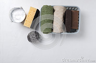 Top view of basket full of sponges,towel,scrubbers, organic soap and bucket of backing soda for green cleaning home. Empty space f Stock Photo