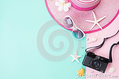 Top view of Beach accessories Picture Frame, sunglasses, starfish beach hat and sea shell on bright pastel green background for Stock Photo