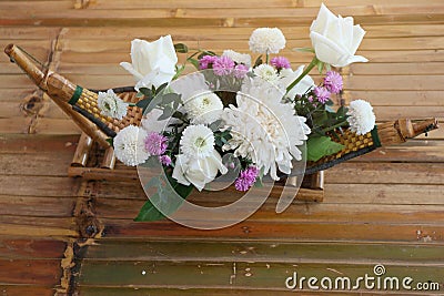 Top view beautiful white flower decoration placed on bamboo table Stock Photo