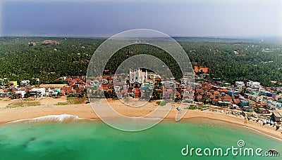 Top view of beautiful white sand beach with turquoise sea water and palm trees, aerial drone shot Stock Photo