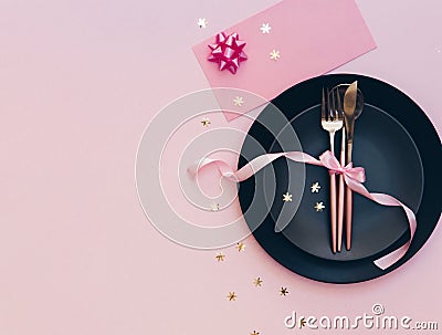 Top view of the beautifully decorated table with plate, card and cutlery Stock Photo